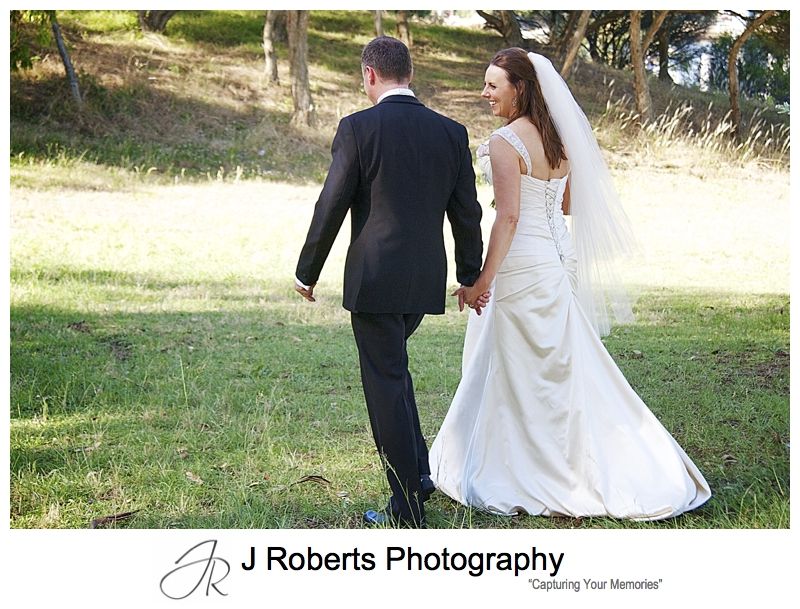 Couple walking through the park - wedding photography sydney